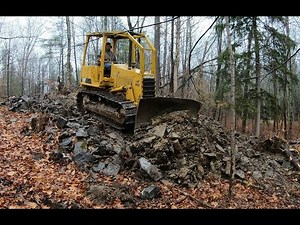 Pushing in a new driveway with a dozer