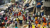 High angle view of a busy Indian market with a diverse crowd of...