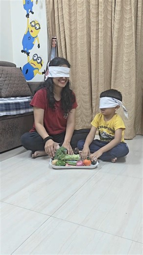The Joy Script on Instagram: "No eyes 👀, Just Hands! 👋🧠 Sensory Game for Kids 🧠 What kids develop by doing this activity: 👋 Tactile sensory skills – identifying objects through touch 🧠 Memory & recall – remembering vegetable names and shapes 👂 Auditory processing – listening carefully to spoken cues 🎯 Focus & attention – staying alert without visual support 🧩 Cognitive association – matching touch with names 💬 Language development – strengthening vocabulary ❤️ Family bonding – learning