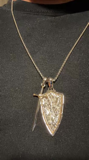 22 inch chain with st Michael pendant and sword . Sterling silver stainless steel