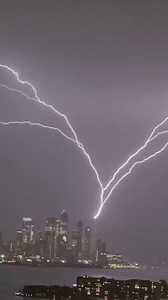 Lightning was seen shooting across Manhattan's skyline during a severe thunderstorm warning issue by the National Weather Service Saturday night. https://abcn.ws/3UhDsf7 | ABC News