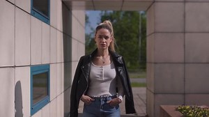 clip-1095916263-beautiful-serious-girl-walking-towards-camera