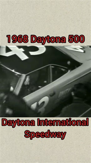 Richard Petty gets out of his car to work on the black roof and windshield during the 1968 Daytona 500! Richard Petty and his black vinyl roof led the race until James Hylton blew a tire and hit the turn one wall. A piece of debris from Hylton's car hit Petty's and knocked the roof loose starting a day of troubles for Richard's team! Petty would finish the race two laps down. #nascar #finallytheweekend #daytona #daytona500 #daytonainternationalspeedway #richardpetty #the60s #ford #fordtorino #gr
