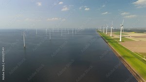 windmill park clouds and a blue sky, windmill turbines generate green energy in the ocean. Energy transition in the Netherlands Europe, row of windmills