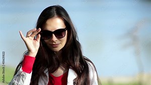 Pretty young woman smiling confidently and looking at you Stock Video