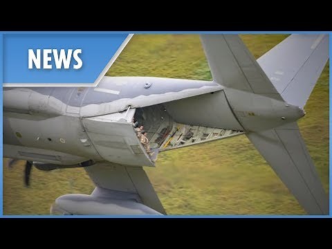 US Air Force crew DANGLE out the rear door of ‎C-130 Hercules
