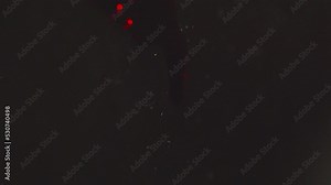 Lights Blinking Behind The Red Blood Dripping On The Glass. - close up