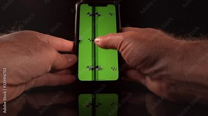 Man using a smart phone with green screen and tracking markers point of view perspective POV
