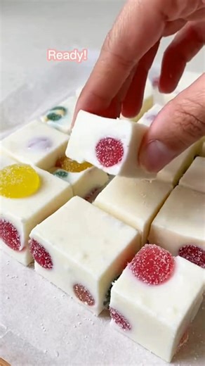 easy 3-ingredient fruity gumdrop nougat candy Festive Easy 3-Ingredient Fruity Gumdrop Nougat Candy Recipe Ingredients: 2 cups white chocolate chips 2 cups mini marshmallows 1 ½ cups chopped fruity gumdrops (use red & green for Christmas) Directions: Line an 8×8 baking pan with parchment paper for easy removal. Melt white chocolate chips in the microwave in 20–30 second intervals, stirring each time until smooth. Add mini marshmallows and stir gently until well coated and slightly softened (but 