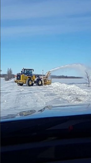 Blowing Snow with a Snogo Blower.