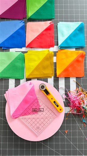 Emma Jean Jansen on Instagram: "I trimmed up the rest of my Half Square Triangle blocks today using my handy Bloc-Loc ruler. Here you ever used one before? They have a little cut out piece in the middle that locks onto the folded seam and makes lining up and cutting these blocks so much easier. I recently managed to get some to sell in my shop. It was a whole process let me tell you, but I’m now selling the two sizes I use in my quilts, a 4.5” and a 3.5”. (Please note they are being sold for the