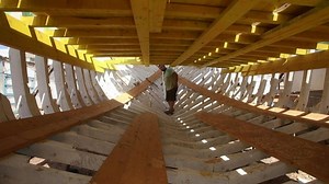 1K views · 32 reactions | Khaled Bahlawan hammers nails in a wooden boat he is building by hand, toiling in the scorching sun everyday to preserve an ancient Syrian craft his family is the last to master. The Bahlawan are the only manufacturers of traditional wooden boats on the Syrian coast, a Phoenician craft dating back thousands of years, now threatened by low demand in the age of technology. | AFP News Agency | Facebook