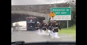 Woman Stuck on Flooded Highway Floored as Cadre of Marines in Dress Blues Begin Wading Toward Her