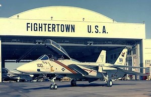 F-14 Tomcat Air Combat Maneuvering Top Gun, Miramar Naval Air Station Made by Grumman to promote the new F-14 Tomcat, this film takes place at Miramar, California and Fighter Town USA. At mark 0:33, Fighter Town USA is seen with various front line Naval aircraft including F-4 Phantoms. Here, pilots are now using lessons from the war in S.E. Asia in developing F-14 combat maneuvering syllabus, using the variable wing at different speed ranges, and getting used to the plane's sophisticated electro