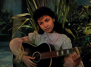 Annette Funicello - Lonely Guitar (1959) In the vibrant tapestry of 1950s pop culture, Annette Funicello's voice stood out distinctly. Transitioning from a Mouseketeer to a recording artist, Annette captivated audiences with hits like "Lonely Guitar," a cherished gem echoing the simplicity and charm of a bygone era. Released in 1959, "Lonely Guitar" marked Annette's shift from television to music. Amid the surf rock craze, it offered a more introspective melody. The song's arrangement blends aco