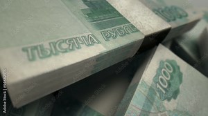 An extreme closeup pan across variously placed bundled wads of russian ruble banknotes