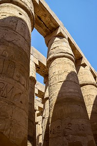 Ancient Egyptian hieroglyphs and symbols carved on columns of the...