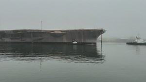 Ex-USS Kitty Hawk towed in its final transit from Naval Base Kitsap – Bremerton, Washington.