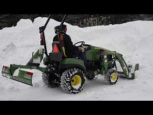 John deere 1023E Winter, Loading snow