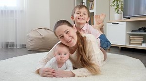 clip-1075344335-happy-smiling-children-hugging-having-fun-mother