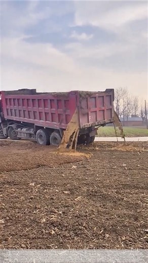 The truck is dumping organic fertilizer.