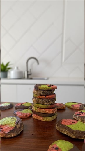 Christie on Instagram: "These slice-and-bake Spumoni cookies are giving Y2K Christmas vibes with swirls of dark chocolate, cherry, and pistachio. The cherry portion is tart and sweet, using @lorannglobal cherry bakery emulsion, freeze dried cherry powder, and dried sweetened cherries. The pistachio dough features lots of finely chopped pistachios, almond extract, and salt, while the chocolate ties it all together with a a dash of espresso to bring out the cocoa flavor, and dark chocolate chunks.