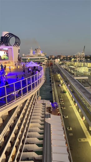 Royal Caribbean Independence of the Seas cruiseship pulling away from the dock in Miami, Florida as seen from MSC Cruises Seaside. #cruises #cruiseships #royalcaribbean #msccruises #portofmiami | Cruiseguru