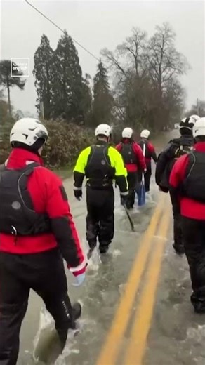 Rescue Team Navigates Flooded Roads in Washington State
