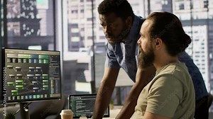 Manager correcting programmer mistakes while conducting code review to fix errors, identifying technical issues with company software. Team leader supervising IT staff member optimizing code, camera A