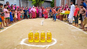 3.2M views · 10K reactions | নতুন গ্রামের মেয়েদের তেলের টাওয়ারের ভিতর দিয়ে রিং গড়িয়ে তেল, আটা জেতার চ্যালেঞ্জ। Local Game | Bangla Food Challenge | Facebook