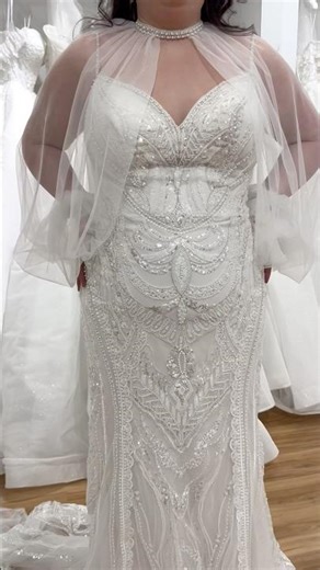 This wedding dress with a bolero jacket gives you versatility from ceremony to reception.