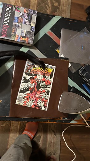 Christopher G. Barron on Instagram: "Pressing a comic with and iron and a teflon sheet."