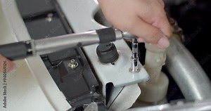 Use a torque wrench for precision.Tension for tightening the nut.Torque wrench.A small torque wrench is suitable for use with smaller nuts.