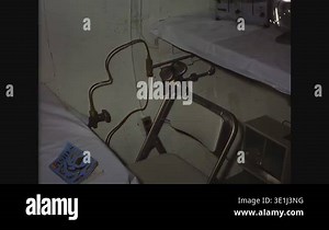 BERMUDA - 1964 - Room in SEALAB I shows table, chairs, toaster, and running fan. Porthole, lights, and six bunks are also visible Stock Video Footage - Alamy