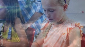 Desk panning showing girls typing in classroom, network overlay supporting learning teacher guiding