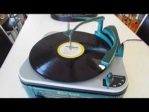 Webcor 3 speed automatic record player / changer playing 33.3 RPM record.
