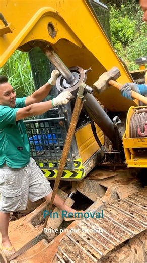 Cooperative Hammer-Pry Dismantling: Remove heavy arm pins flawlessly with hammering and prying.🔧⚙️