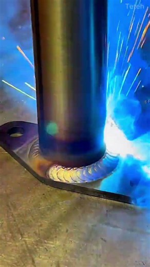 Welding a metal pipe onto a flat steel base plate precisely using a MIG welding torch