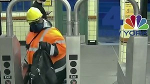 New video shows shooting suspect entering Brooklyn subway station with bags