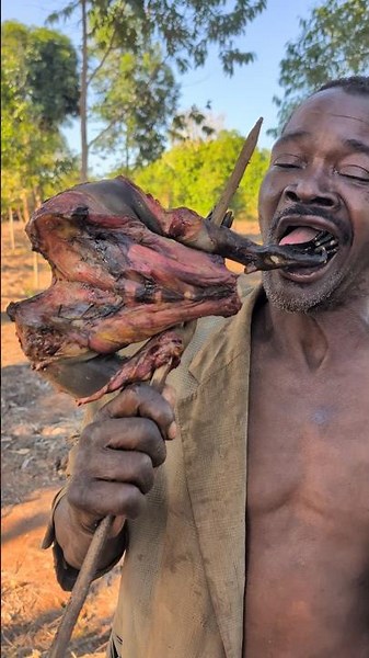 "Monkey meat prepared the traditional way — nourishment rooted in centuries of Bushmen culture."