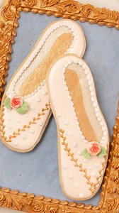 I was inspired to make these pointe shoe cookies after seeing a real-life pair of the prettiest pointe shoes in the window of @kingstoncandybar! They're decorated with royal icing and @sweetsticksau edible paint. #royalicingart #royalicingcookies #icingcookies #decoratedcookies | SweetAmbs