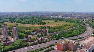 London, England: Aerial view of capital city of UK, iconic Victoria Park, 86 hectares of Victorian greenery in heart of East London - landscape panorama of United Kingdom from above