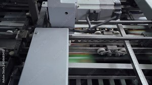 Offset printing press, printing production, industrial machine. Print house. 4k footage.