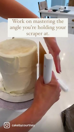 Just adjusting the angle of your scraper can have a huge impact on getting smooth, straight sides. #cakedecorating #caketiktok #caketips
