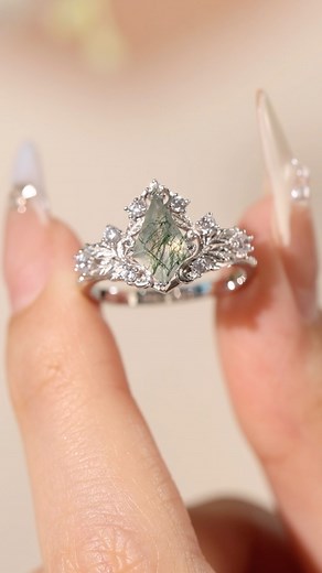 4.5K views · 6 comments | Regal Tiara Moss Agate Ring, a jaw-dropping design featuring a kite-shaped moss agate stone. The perfect holiday gift!  #mossagatering #mossagatejewelry #nature #natureinspired #engagementring #weddingring | Azura Jewelry | Facebook