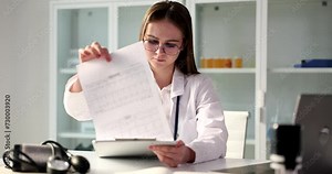 Cardiologist examines cardiogram data in clinic. Prevention treatment of heart disease and arterial hypertension