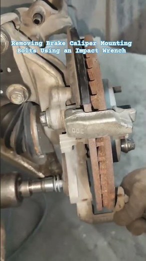Removing Brake Caliper Mounting Bolts Using an Impact Wrench