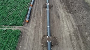 clip-1056744899-aerial-view-gas-oil-pipeline-construction-pipes