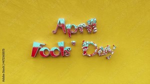 Happy April Fools Day, first april funny festival of humor and joke text inscription, fun and prank holiday concept, decorative animated lettering, humorous festive greeting card motion background