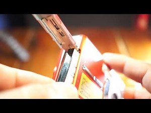 How to remove battery from Kodak M753 plus sd card slot